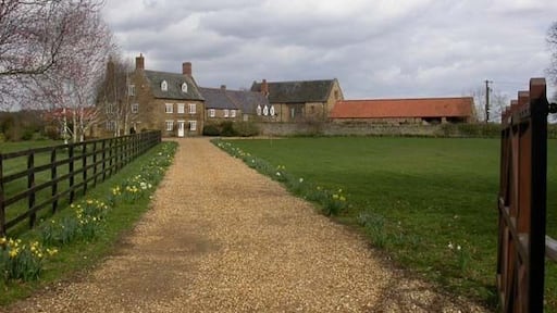 Hayes Lodge The driveway of this rather grand farmhouse is opposite the entrance to a camping and caravan site.