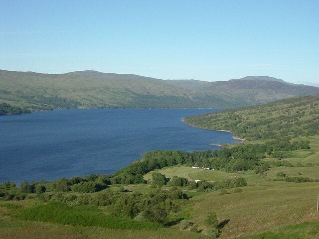 Loch Katrine Looking ENE along the loch with Ben Vane poking over the ridge in the far distance right. The loch is 8 miles long with a maximum depth of 500 feet. The level was raised to increase capacity when the loch was dammed to provide a clean water supply for Glasgow in the mid 1800's
