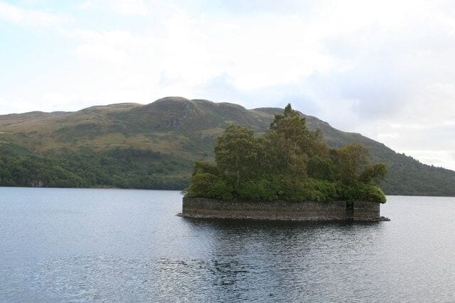 Factor's Island, Loch Katrine. In the course of his long-running dispute with the Duke of Montrose, the well-known historical figure Rob Roy once imprisoned the Duke's factor (who acted as agent and rent collector) on this island, also known as Eilean Dharag. The stone wall was added to protect the island when the water level in Loch Katrine was raised in connection with its use as a water supply for Glasgow, which it has been since 1859. 'Katrine' derives from the Gaelic 'cateran', meaning a Highland robber.