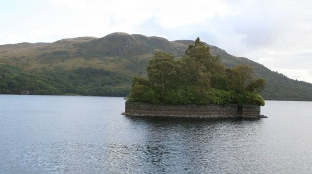Factor's Island, Loch Katrine. In the course of his long-running dispute with the Duke of Montrose, the well-known historical figure Rob Roy once imprisoned the Duke's factor (who acted as agent and rent collector) on this island, also known as Eilean Dharag. The stone wall was added to protect the island when the water level in Loch Katrine was raised in connection with its use as a water supply for Glasgow, which it has been since 1859. 'Katrine' derives from the Gaelic 'cateran', meaning a Highland robber.