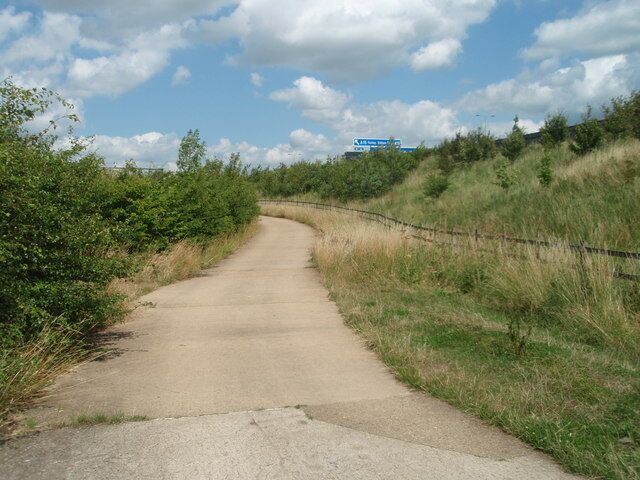 Footpath Just over the embankment 8 lanes of A1M thunder past.