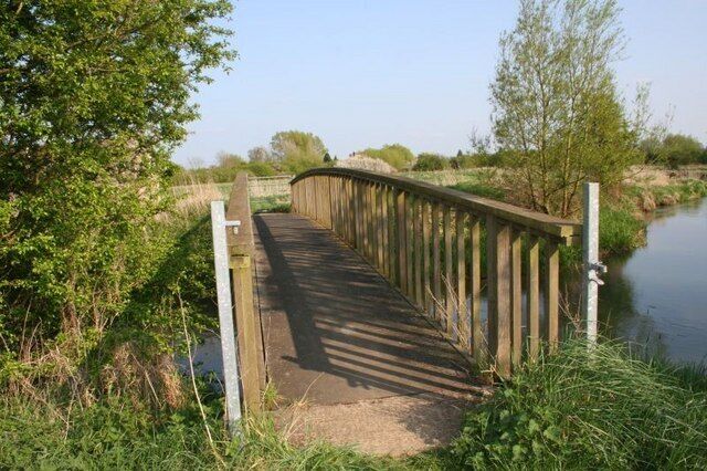 Bridge by the pillbox The bridge which runs over the river Windrush and stands just by a pillbox. The bridge takes a footpath along the river to the Thames or Isis as it is also called round here.