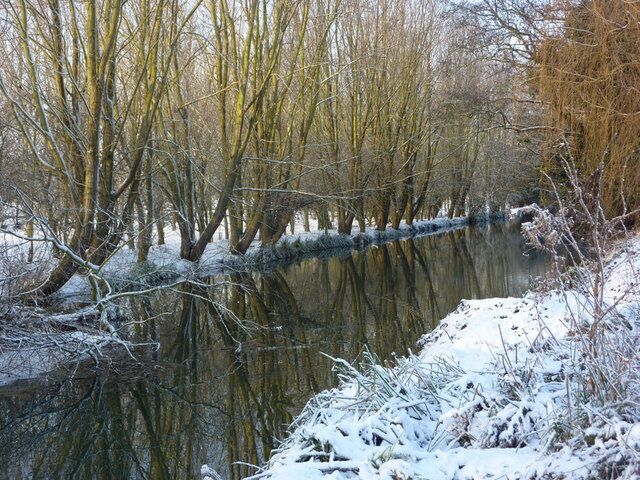 River Gipping north of Sproughton A tree lined section of the river on a snowy day with reflections.