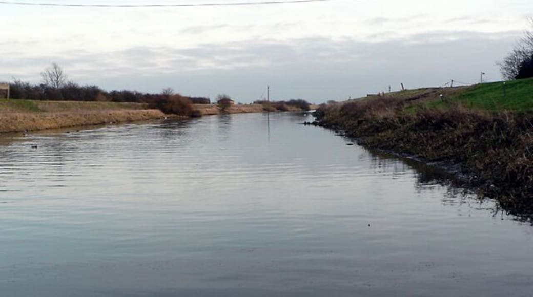 River Witham. Looking southeast from the White Horse jetty. The line of the dismantled railway follows the top of the northern embankment.