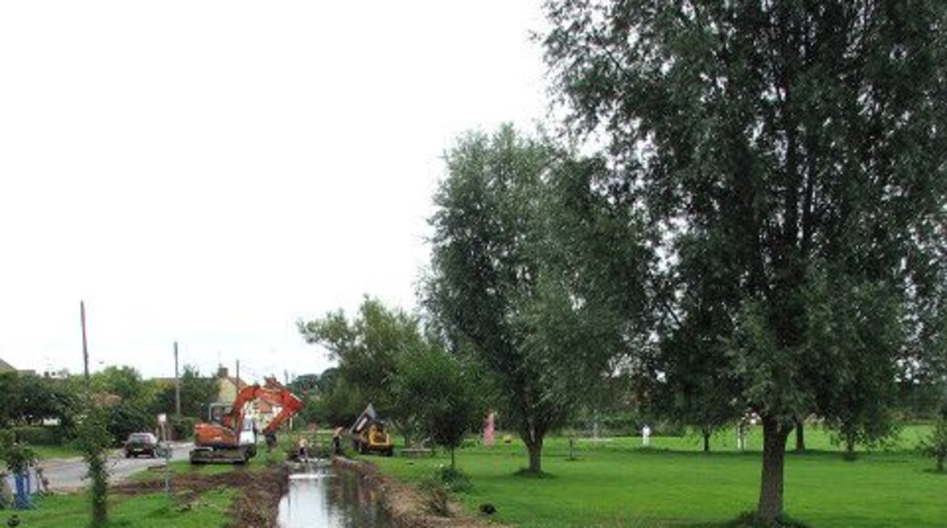 The River Burn by the green in South Creake. The village of South Creake is located on the B1355, five miles northwest of Fakenham and one mile south of the twin village of North Creake. The River Burn which merges with the North Sea at Holkham beach > 941139 - 941150 flows through the centre of the village.