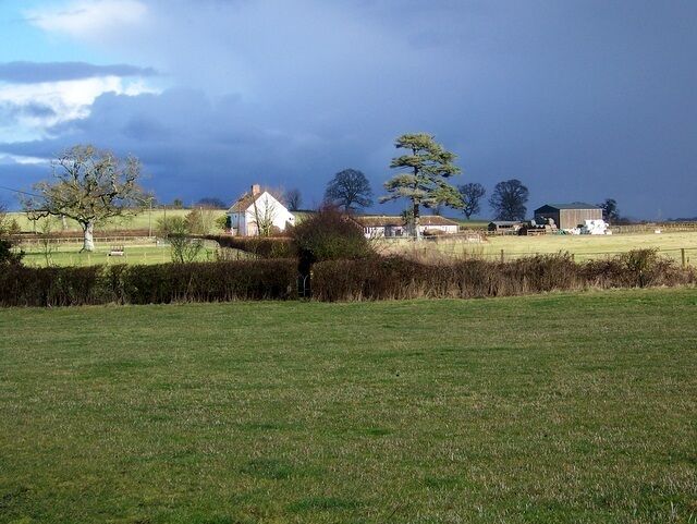 Footpath, South Barrow The footpath crosses a small field before crossing a small stream as it heads towards Midknowle Farm.