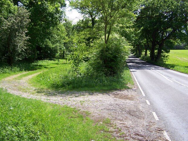 Braker Hill A view south down the main road with the gated track leaving off to the left towards Braker Hill.