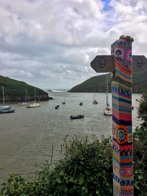 Coastal Path from Solva . This spot is just as you ascend north out of Solva past the harbour. You can see the mouth of the river opening out to the Irish Sea. A great place to park next to the Harbour Inn. You can see an example of Knit bombing (Yarn Bombing) on the way post.