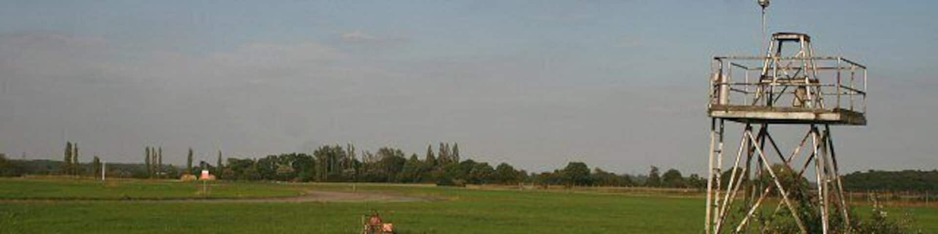 Watchtower at RAF Wethersfield Viewed from the southern perimeter fence, the tower and part of the runway can be seen. The airbase, operated by the US Air Force, closed down in 1990.