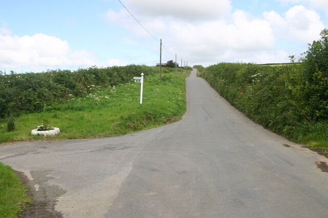 Minor road passes lane to Upcott Minor road passes lane to Upcott