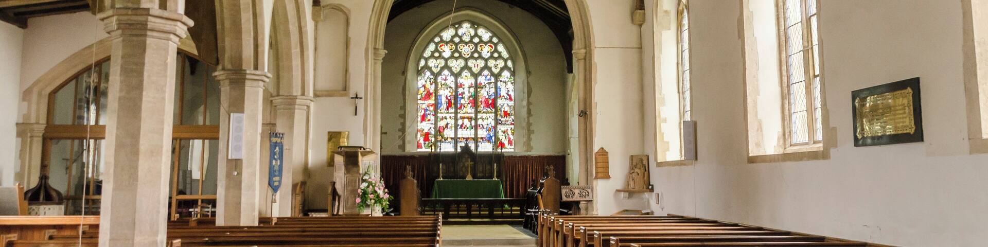 The church dates from the 13th century onwards, with several restorations in the 19th century. It consists of a western tower, nave with south porch, clerestory and north aisle, chancel with chapel, and vestry. The unbuttressed tower dates from the 13th century and is topped by a two tier lantern of lead-covered wood. The tower is rendered, with a battlemented parapet. There is also a bellcote at the east end of the nave. The nave has a clerestory to the north side, and the north arcade is of five bays with octagonal piers. There is a two bay arcade to the north chapel. The north aisle has a late medieval roof with large arched braces, but the roof to the north Chapel is somewhat earlier. There are two fonts, one of which is Norman. The pulpit dates from the early 17th century, and there is also a fine wooden lectern from circa 1500, with lions at the foot. There is a two manual organ which was replaced in 1985.
