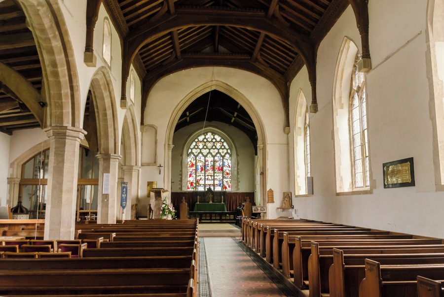 The church dates from the 13th century onwards, with several restorations in the 19th century. It consists of a western tower, nave with south porch, clerestory and north aisle, chancel with chapel, and vestry. The unbuttressed tower dates from the 13th century and is topped by a two tier lantern of lead-covered wood. The tower is rendered, with a battlemented parapet. There is also a bellcote at the east end of the nave. The nave has a clerestory to the north side, and the north arcade is of five bays with octagonal piers. There is a two bay arcade to the north chapel. The north aisle has a late medieval roof with large arched braces, but the roof to the north Chapel is somewhat earlier. There are two fonts, one of which is Norman. The pulpit dates from the early 17th century, and there is also a fine wooden lectern from circa 1500, with lions at the foot. There is a two manual organ which was replaced in 1985.