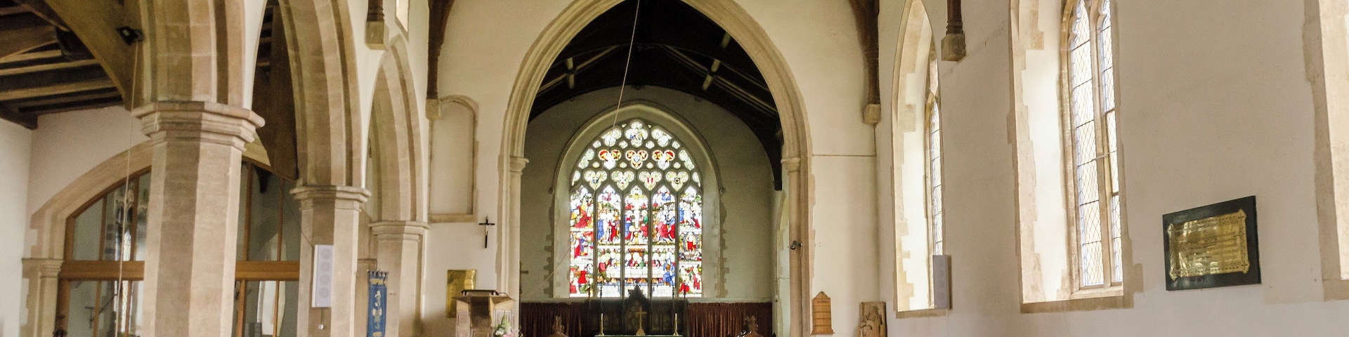 The church dates from the 13th century onwards, with several restorations in the 19th century. It consists of a western tower, nave with south porch, clerestory and north aisle, chancel with chapel, and vestry. The unbuttressed tower dates from the 13th century and is topped by a two tier lantern of lead-covered wood. The tower is rendered, with a battlemented parapet. There is also a bellcote at the east end of the nave. The nave has a clerestory to the north side, and the north arcade is of five bays with octagonal piers. There is a two bay arcade to the north chapel. The north aisle has a late medieval roof with large arched braces, but the roof to the north Chapel is somewhat earlier. There are two fonts, one of which is Norman. The pulpit dates from the early 17th century, and there is also a fine wooden lectern from circa 1500, with lions at the foot. There is a two manual organ which was replaced in 1985.