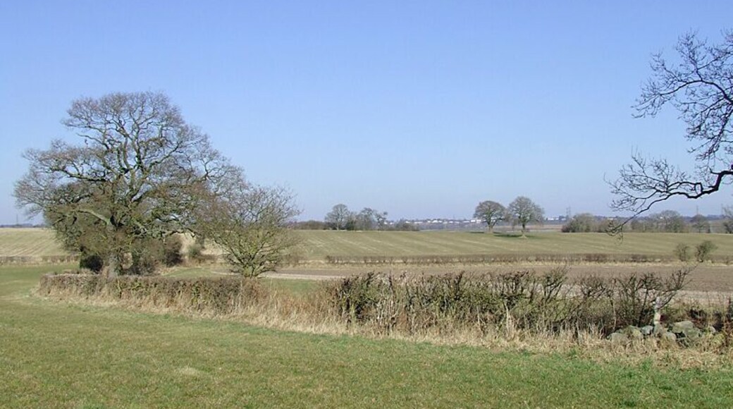 Farm land near Seisdon, Staffordshire. Looking towards land near Blakeley Pool Farm. Grass and crop growth is a month or more later than usual because of an extended cold winter, apparently the coldest for thirty one years. Behind the hedge and leading to the trees on the left is a farm track with public footpath access. 1750406