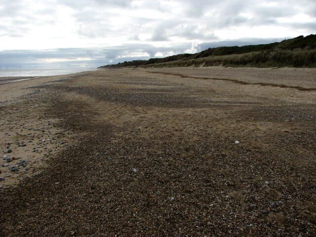 Looking SE on Scratby Beach Addendum: a six metre wide strip of dunes has been scoured away by the tide waters on occasion of the unusually high surge of the North Sea along the east coast, caused by high winds, on 9th November 2007; the cliffs remained unscathed thanks to a rock berm.