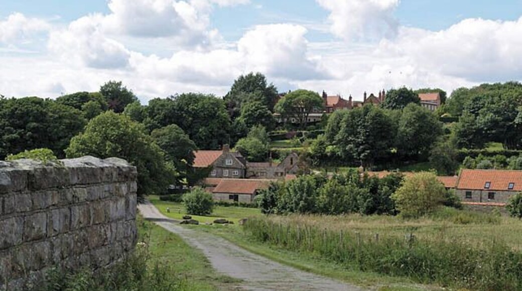 Lane to Cloughton Looking towards Cloughton along Salt Pans Road. The wall on the left is the parapet of a bridge over the old Whitby-Scarborough railway line.