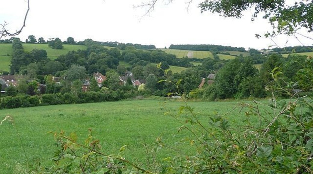 View across Swampton From a minor road in the north-east corner of the square showing the village in its setting in the valley of the Bourne Rivulet.