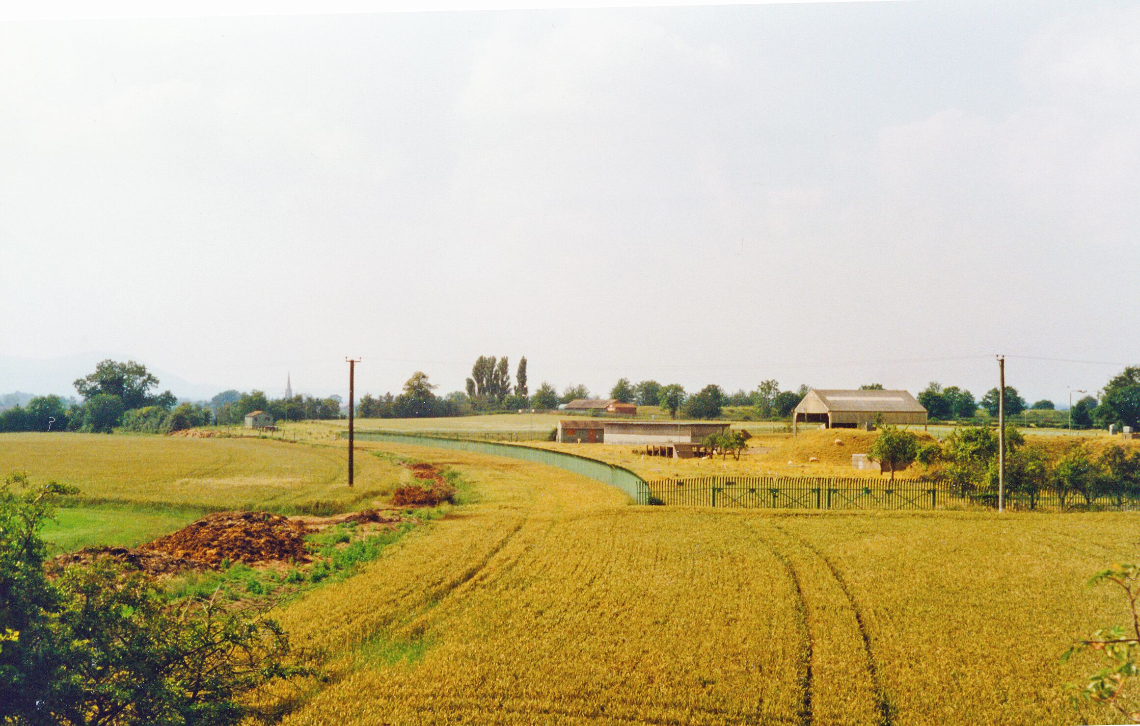 Site of former Oil Depot on Ashchurch - Malvern line at Saxon's Lode by River Severn, 1997. View NW towards Malvern, on the former Midland Railway Ashchurch - Great Malvern branch, closed to Upton-on-Severn 1/7/63 (Upton - Malvern 1/12/52). The Depot was supplied mainly by tankers on the River Severn, but was connected to the railway, some track of which is still visible.