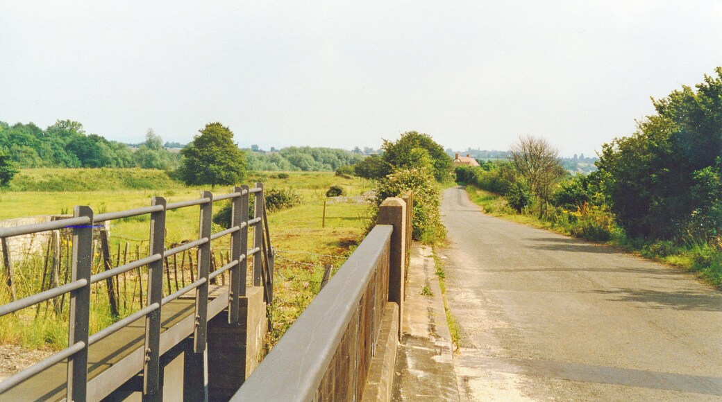 Bow Lane, Ripple, at bridge over M50 Motorway, 1997. View SE towards Twyning and Tewkesbury, parallel to right of the track-bed of the former ex-Midland Railway Ashchurch - Upton-on-Severn - Great Malvern branch, which was finally closed 1/7/63. The River Severn is over to the right.