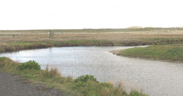 A meander on the Crigyll between the two bridges The approach lights to Runway 32 can be seen beyond the bend