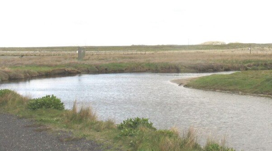 A meander on the Crigyll between the two bridges The approach lights to Runway 32 can be seen beyond the bend