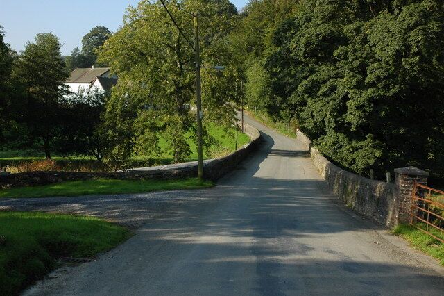 Road through Caio The white building through the trees on the left is the chapel.