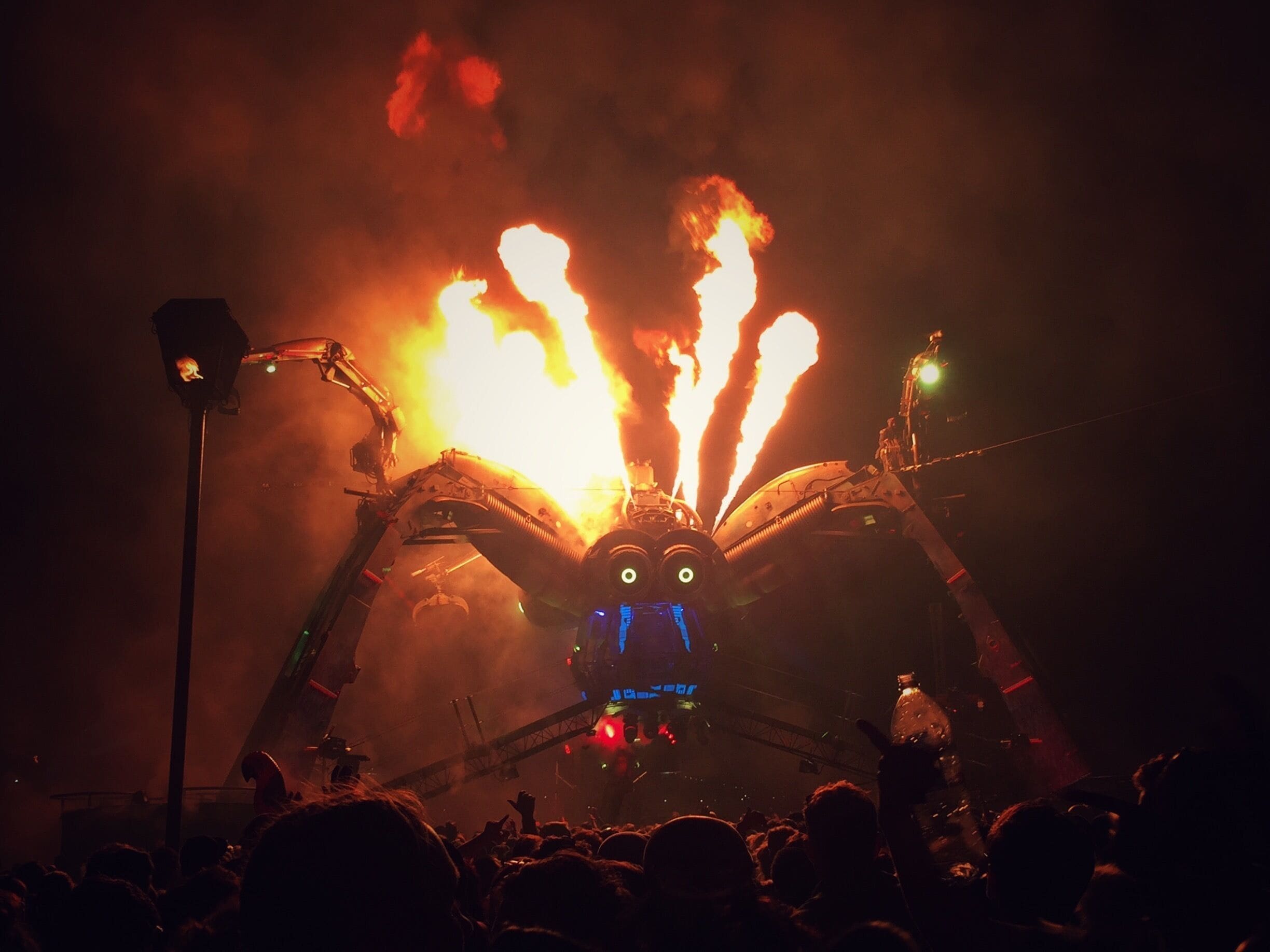 Giant, mechanical spider... spitting out fire and lasers! Run for the hills. 

#festival #music #art #fire #laser #dance