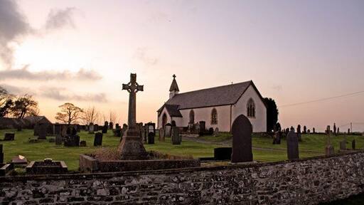 Parish Church, Llanbadarn Trefeglwys I became aware of this site while browsing Geograph. The heavily-restored church is unremarkable, but the massive circular churchyard is spectacular, and characteristic of a very early foundation. Allegedly the church was founded in the 6th century, although this was probably a sacred site long before that. As the sun sets over Ireland, it certainly evokes the "Age of the Saints".