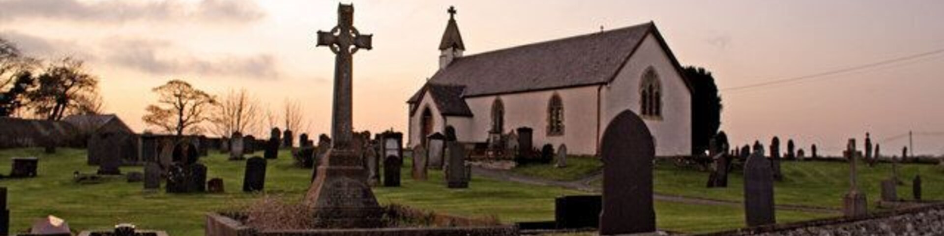 Parish Church, Llanbadarn Trefeglwys I became aware of this site while browsing Geograph. The heavily-restored church is unremarkable, but the massive circular churchyard is spectacular, and characteristic of a very early foundation. Allegedly the church was founded in the 6th century, although this was probably a sacred site long before that. As the sun sets over Ireland, it certainly evokes the "Age of the Saints".