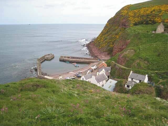 Pennan Harbour seen from the carpark Although there is a road down to the harbour and village, motorists would be well-advised to park at the top of the cliff, as the road is precipitously steep with sharp bends.