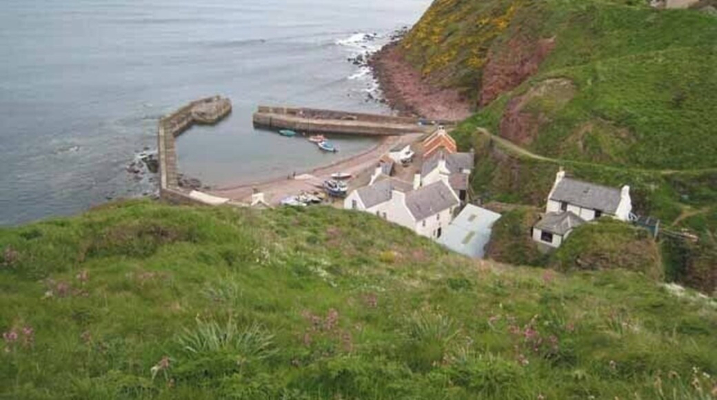 Pennan Harbour seen from the carpark Although there is a road down to the harbour and village, motorists would be well-advised to park at the top of the cliff, as the road is precipitously steep with sharp bends.