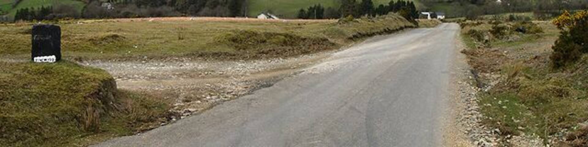 Road Stretch of road and the entrance to Nant-yr-hendre and Tynewydd.