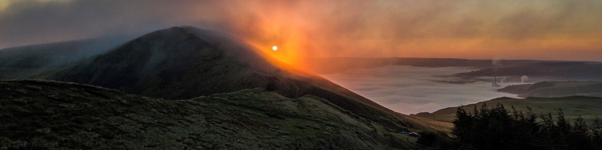 Sunrise behind Mam Tor in the Peak District, Derbyshire, England, taken with a Mavic Pro drone with the cloud inversion in the Hope Valley behind.