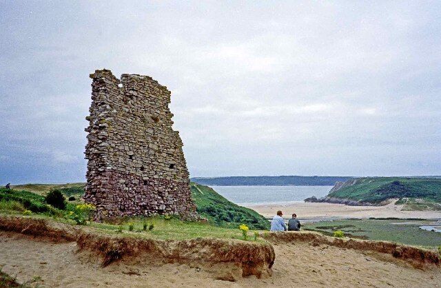 Ruins of Pennard Castle. Ruins of Pennard Castle with Three Cliff Bay in the distance.