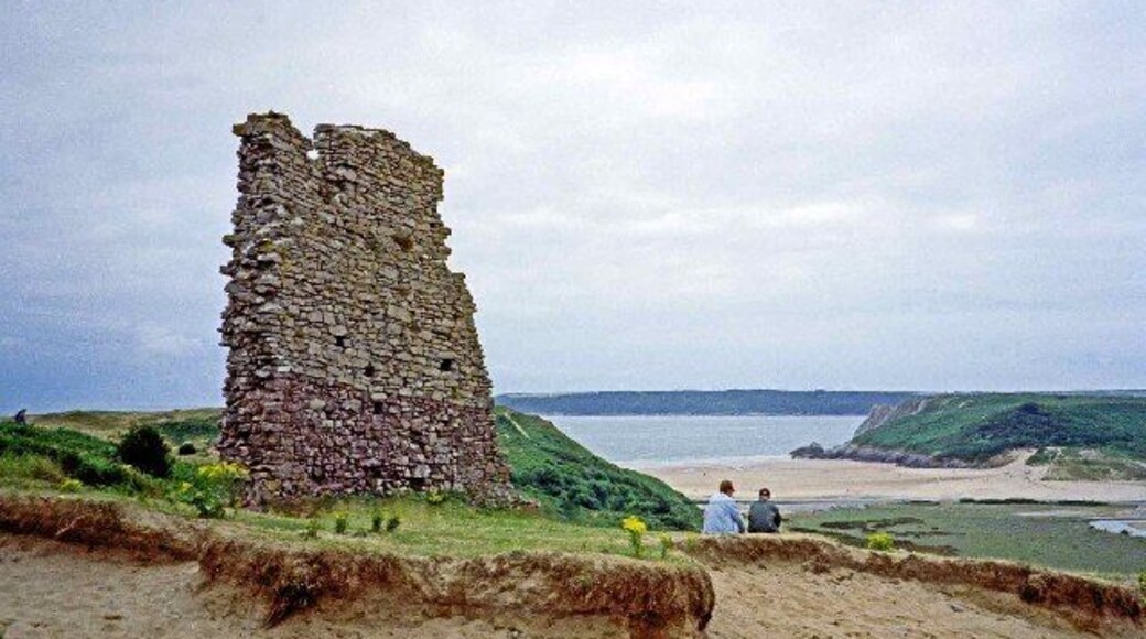 Ruins of Pennard Castle. Ruins of Pennard Castle with Three Cliff Bay in the distance.