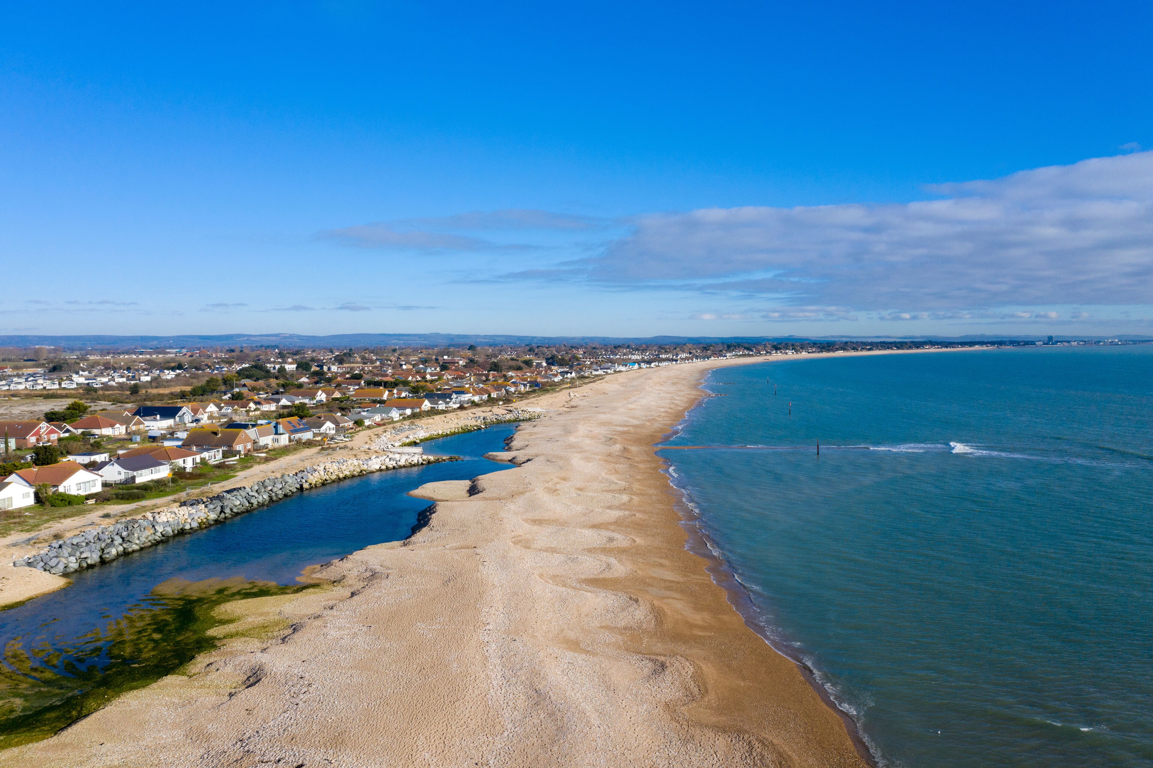 Pagham Village and beautiful beach aerial on a fine and sunny winters day.