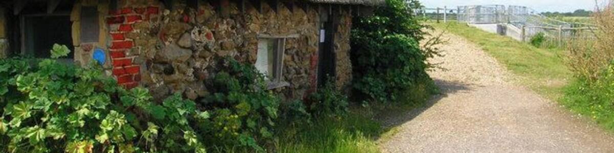 The Salthouse, Pagham Harbour Restored thatched building once used for storing salt now used for tourist information. Located on the corner of Pagham harbour before the footpath heads off across Pagham Wall.
