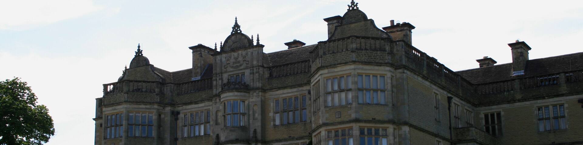 View of English country house Stokesay Court from the lawn.