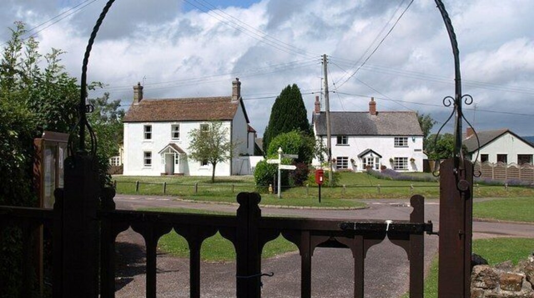 Village green, Hillfarrance. Seen through the arch at the entrance to the churchyard, which also appears in 1394479. An interesting page of historical snippets is at http://www.oake.org.uk/hillfarrance%20history.htm .
