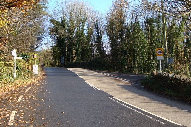 The turning to Diptford, at Avonwick. The peak in the road is the bridge over the dismantled railway, also posted for this square - see 1048080