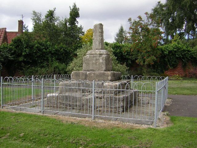 Base and broken shaft of the 14th-century stone cross in High Street, Collingham, Nottinghamshire