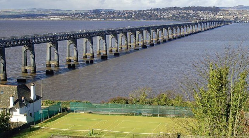 Tay Bridge from Wormit Designed by WH Barlow and constructed by William Arrol this 3500 metre long second bridge, built 60 feet upstream of the original bridge, opened for service in July 1887. The stumps of the original can clearly be seen in this low tide shot.