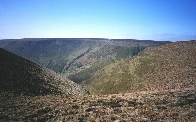 Harley Dingle. The place names in the Radnor Forest are often Herefordshire English. The Harley's are still a big landowning family in the area, they gave their name to Wigmore and Harley streets in London. Looking into the depths from south of Black Mixen (Mixen = midden). The dingle is used to test ammunition for Eley of Birmingham. Across the defile is the corrie of Pant and the Radnorshire high point, Great Rhos.