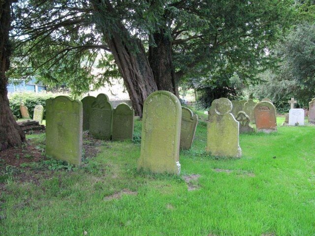 Graves by the yew tree Graves in St Michaels Churchyard under a couple of the yew trees that are growing there.