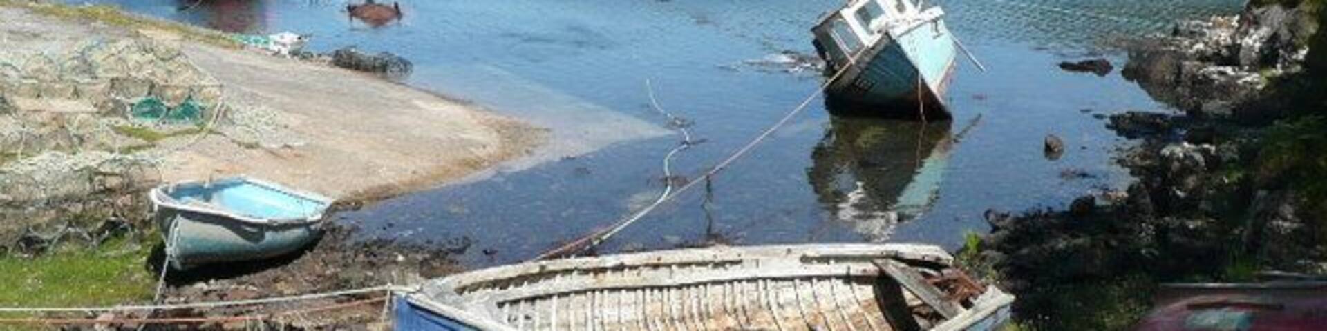 Junk and dereliction at Nedd A pretty sea loch is spoiled by rotting rubbish.