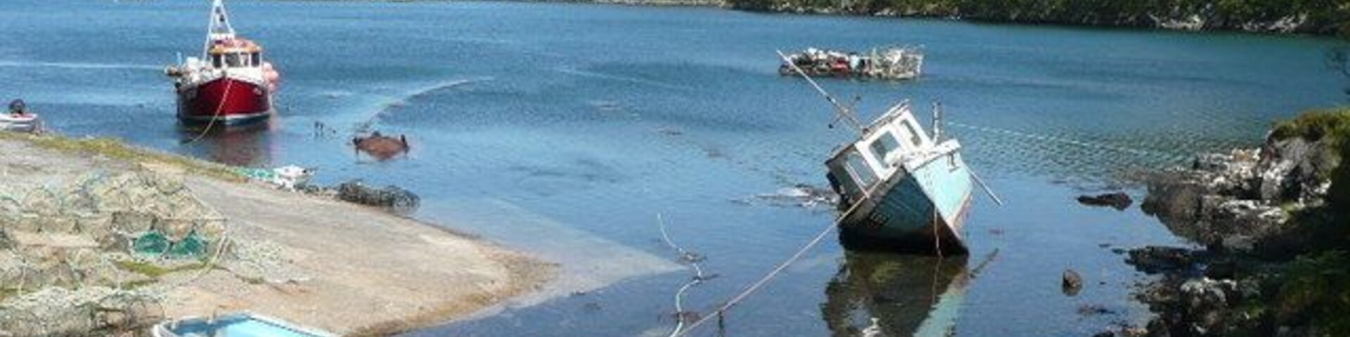 Junk and dereliction at Nedd A pretty sea loch is spoiled by rotting rubbish.