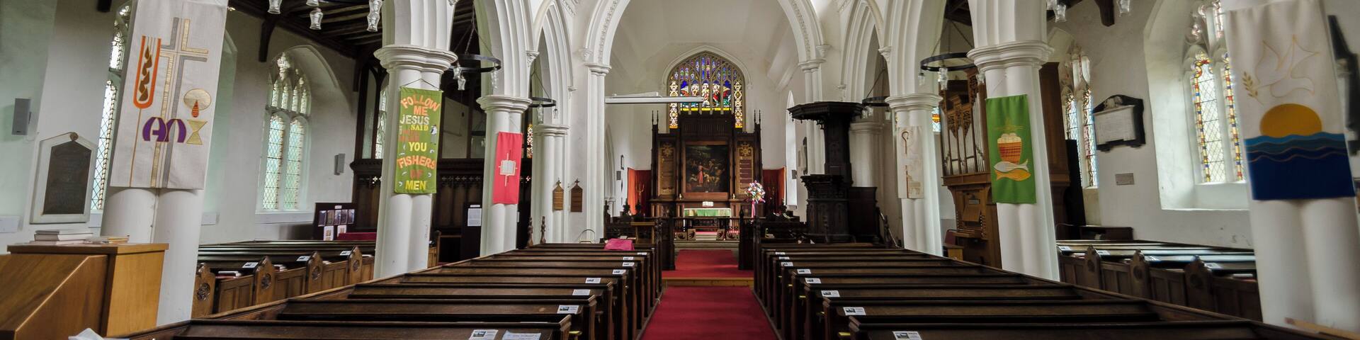Grade I listed The church dates mainly from the 14th and 15th century, the west tower was rebuilt in 1864. There is a west tower, nave, chancel, north and south aisles and clerestory, north vestry, and south-west Chapel. The church is built in flint and stone with some checker work. The tower has an embattled parapet with crocketted pinnacles, the octagonal tower Lantern was added in the 19th century. The east end of the nave has a small Sanctus bellcote on the roof. The nave has north and south aisles of four bays with further bays for the north Chapel. The clerestory was added in the 15th century. There is a fine 15th century hammerbeam roof with carved Angels and original colouring. In the chancel, there is a 19th-century reredos with a painting of "The raising of Lazarus". The east window has glass by De la Roche of Paris, 1844. The pulpit is octagonal, with tester from 1636, and there is a 14th century piscina in the north east Chapel. There are several brasses in the church, however these are covered by carpet. The interior of the church has been whitewashed, including the coved chancel ceiling. There is a small two manual organ which was installed in 1990.