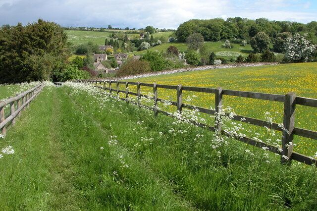 Naunton. Like many Cotswold villages Naunton is located in a valley, here it is viewed from a footpath to the south.