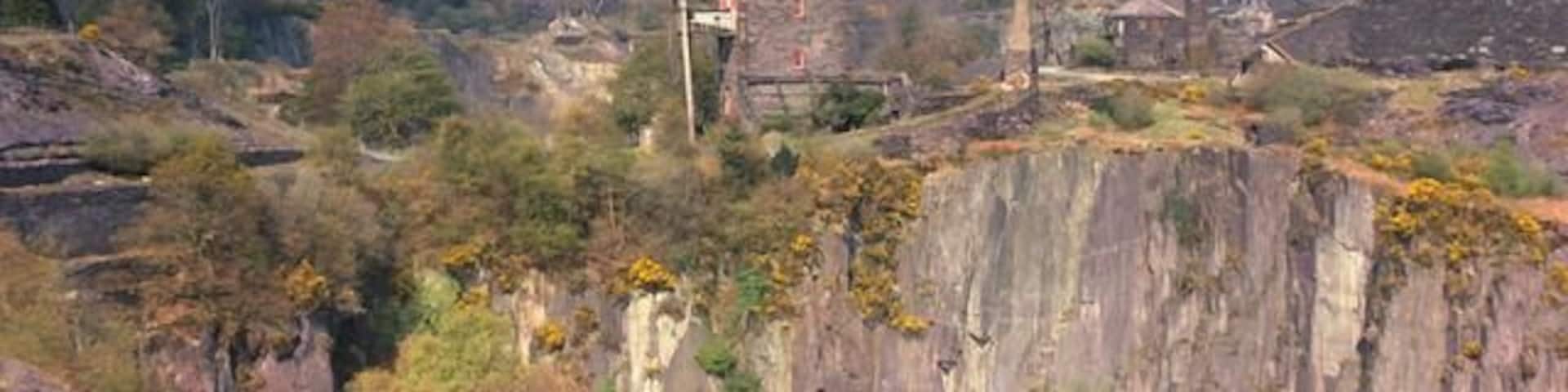 Dorothea pumping engine and Penyrorsedd Quarries. The view shows the apparently precarious situation of the engine house between two of the quarry pits. The Penyrorsedd workings can be seen away into the distance. As can be seen in 2106 nature is reclaiming this industrialised area and the view in this 1976 picture would be difficult to replicate today.
