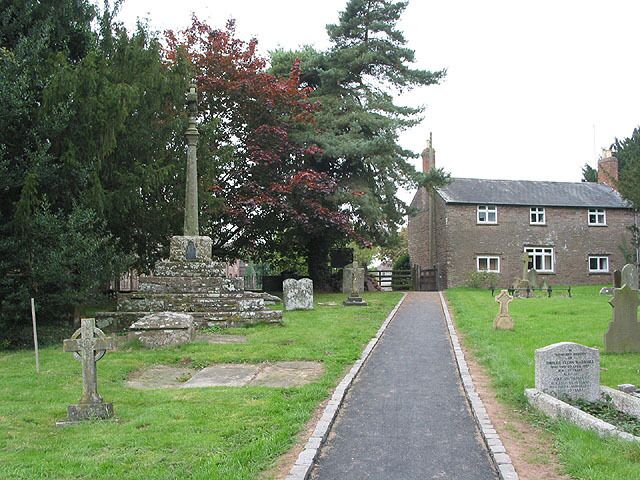 Part of St David's parish churchyard, Much Dewchurch, Herefordshire, with the churchyard cross on the left